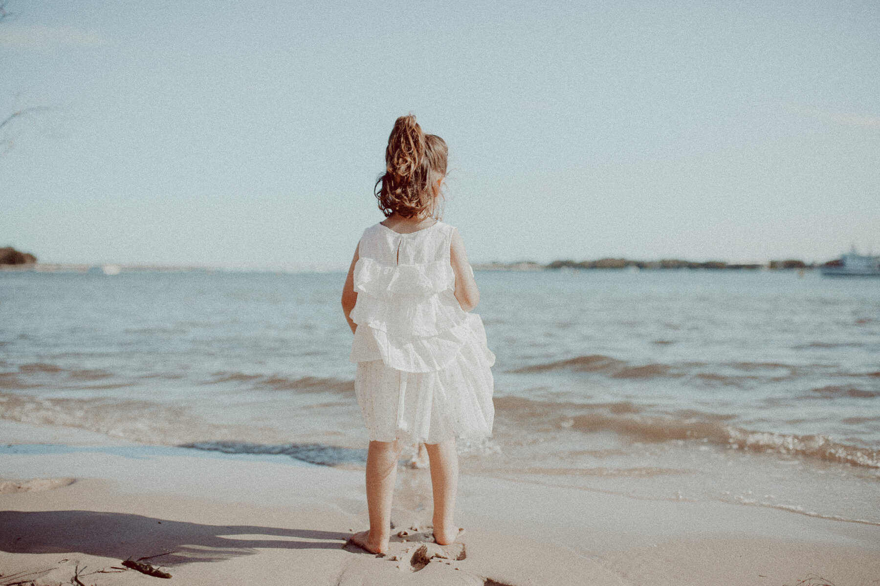 Little girl watching the horizon Sylvan Beach Bribie Island 