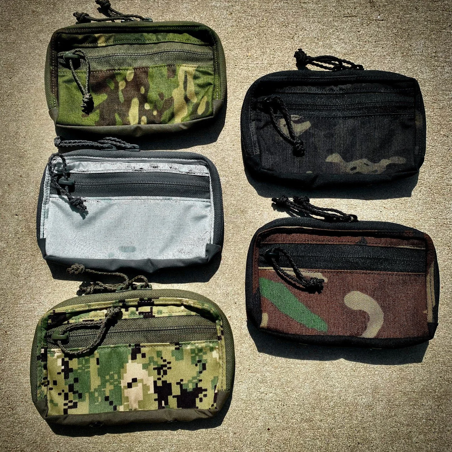 The MIC Admin Pouch keeps essentials organized and within reach. Features a 90&deg; opening main pocket with Velcro loop lining, plus a front pocket for essentials - multiple patterns available!