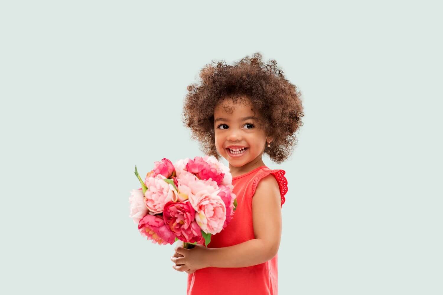 little girl holding flower bouquet