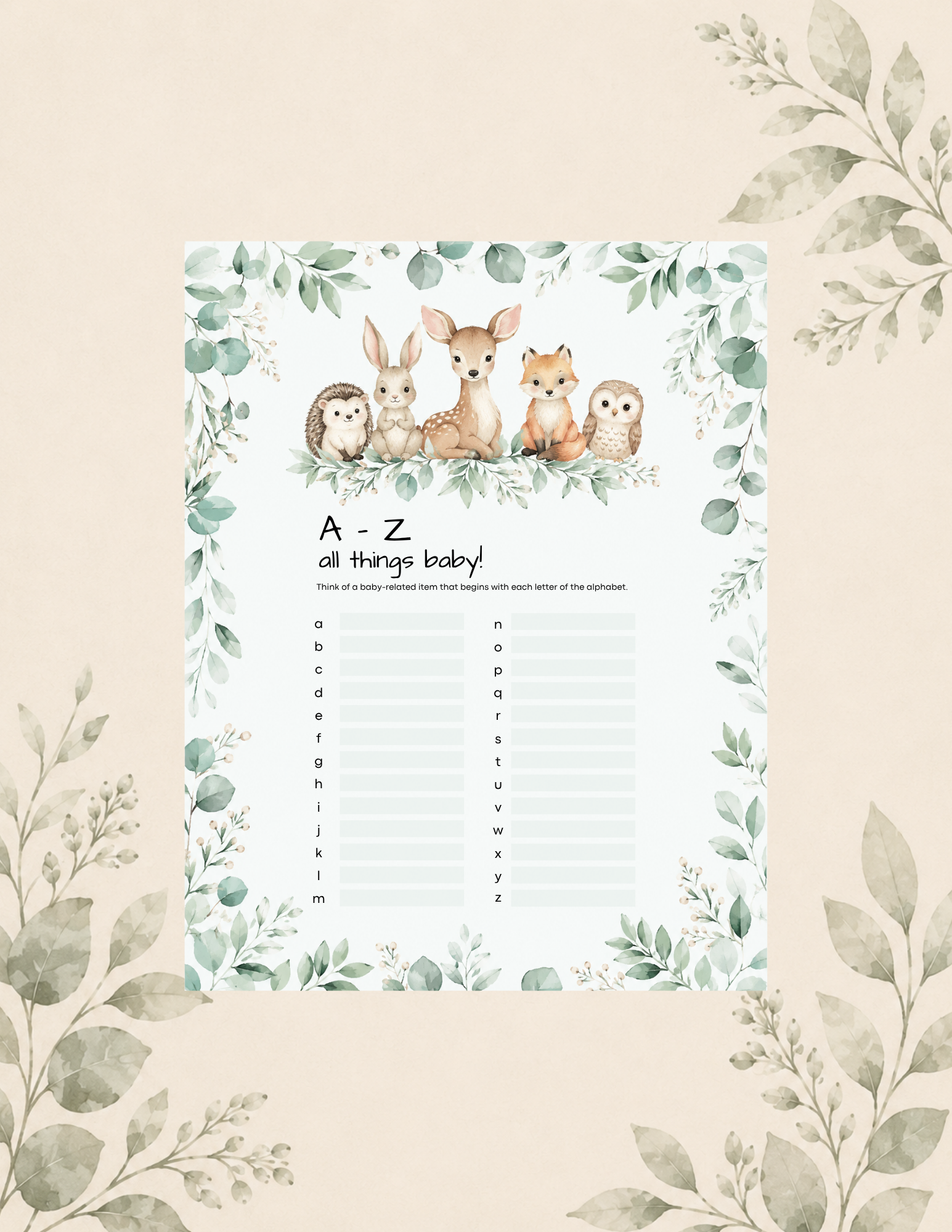Woodland-themed baby shower game printable titled "A–Z All Things Baby" featuring a deer, bunny, hedgehog, fox, and owl surrounded by greenery. The game asks guests to write a baby-related item for each letter of the alphabet from A to Z.