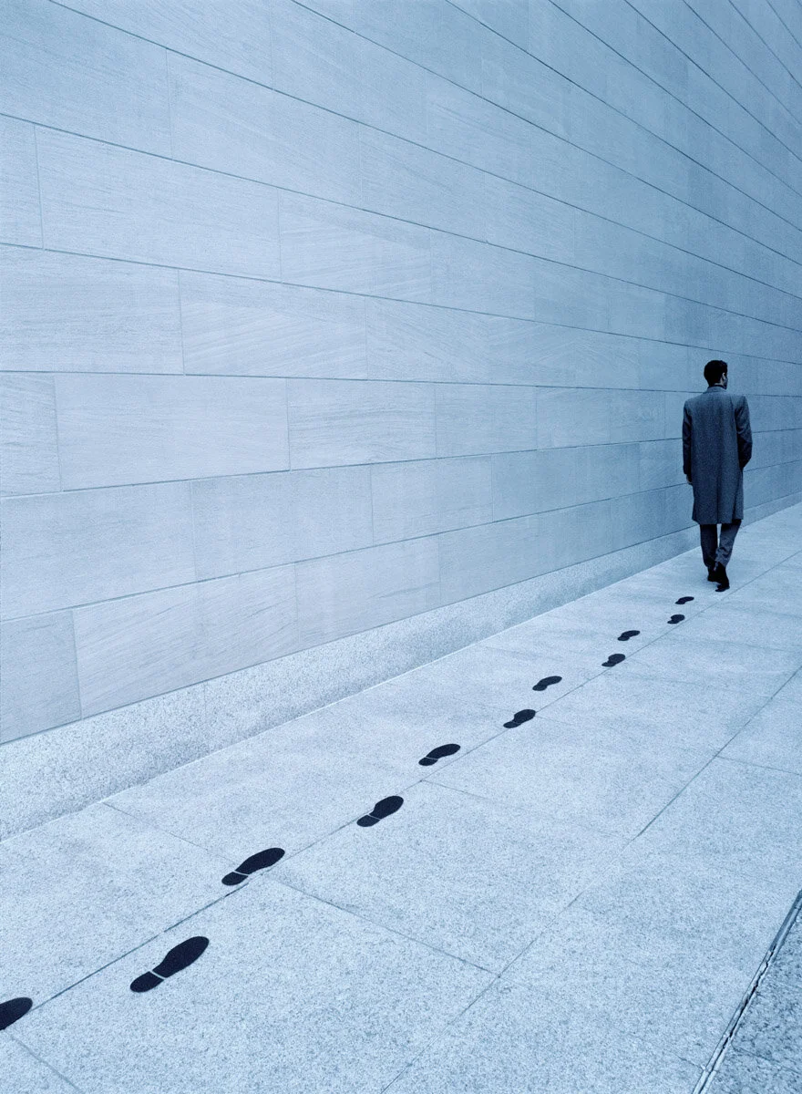 man with footsteps flat.jpg