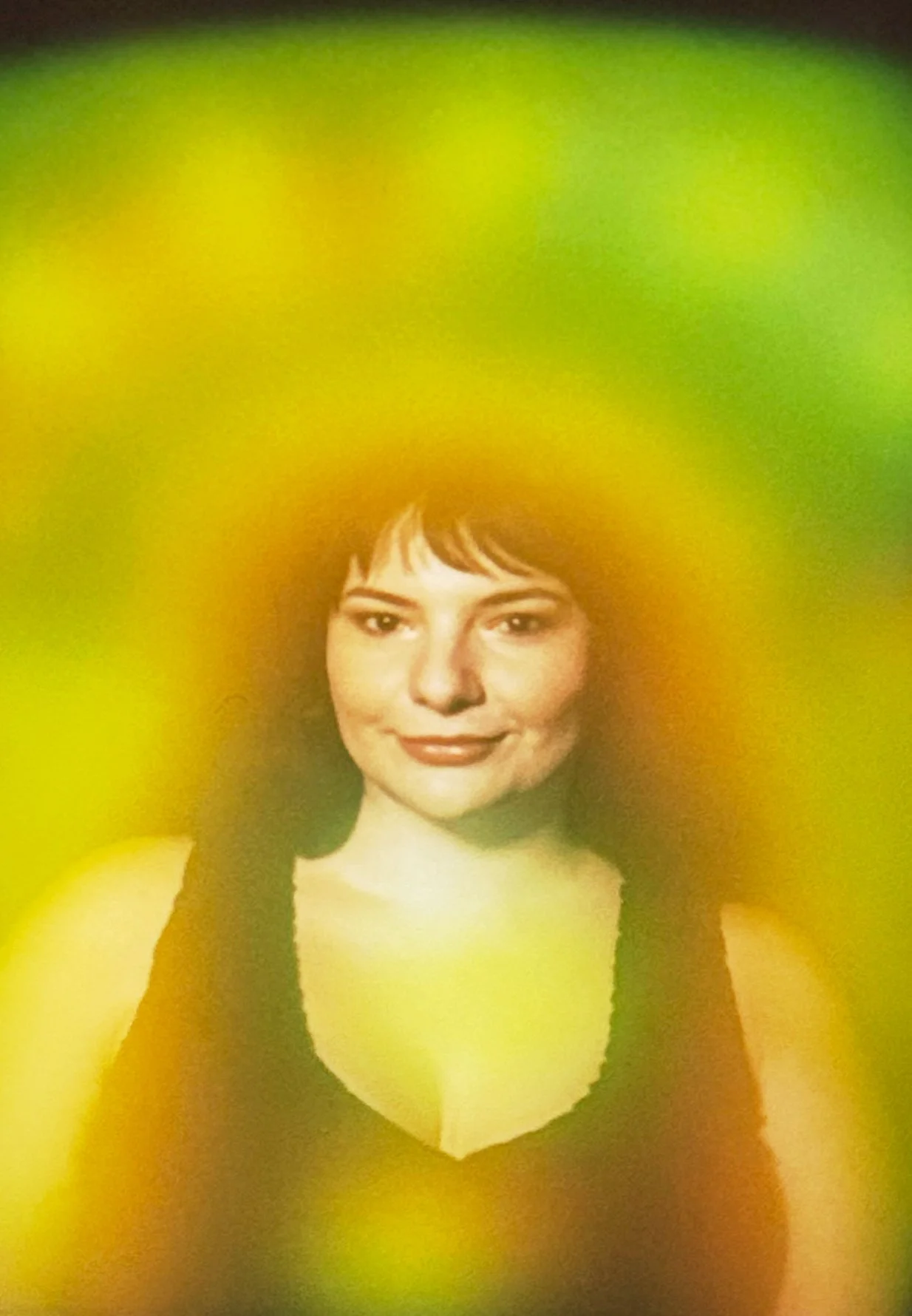 Green aura and yellow aura photo showing an even emerald field around a woman.