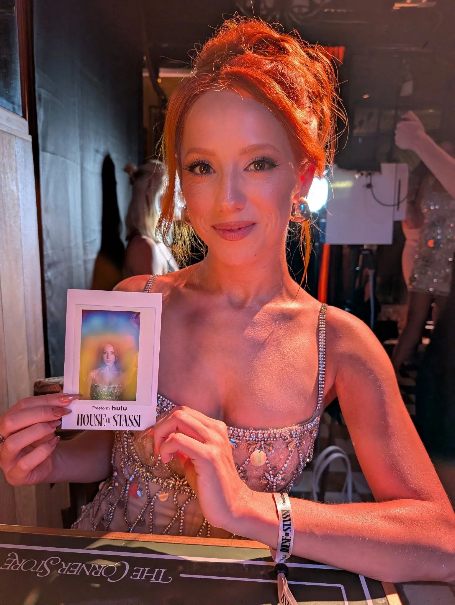 House of Stassi cast member Georgianna Brianne holding her aura portrait