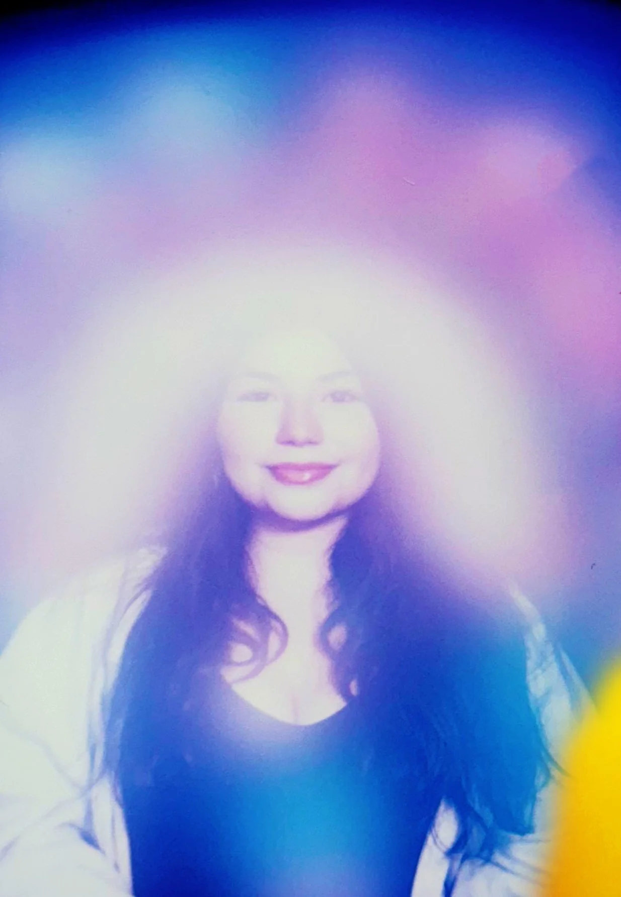 Violet and white aura photograph of a woman.