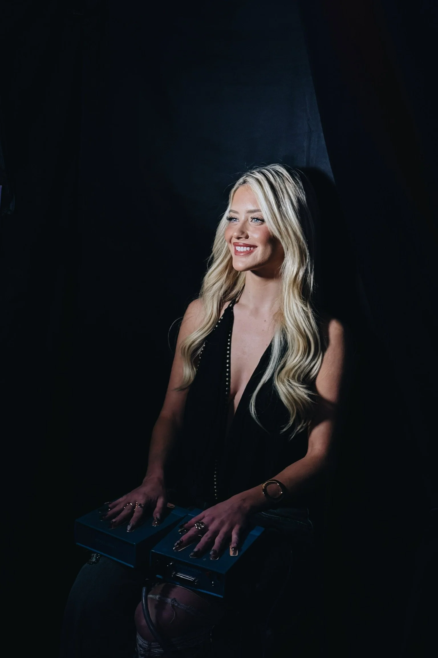 Kaylor from Love Island sits inside the Aura Booth