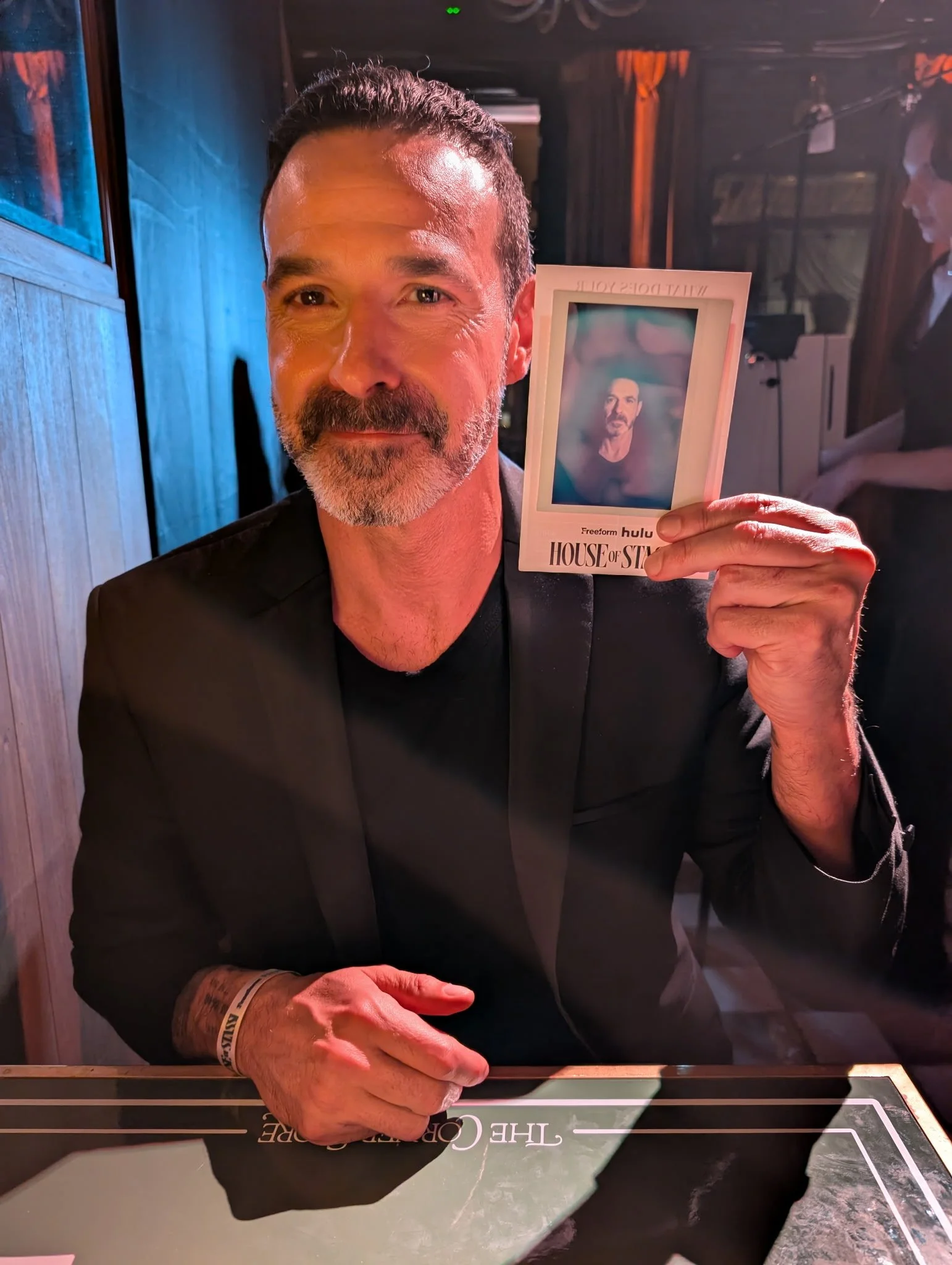 House of Stassi cast member Rob Evors holding his aura portrait