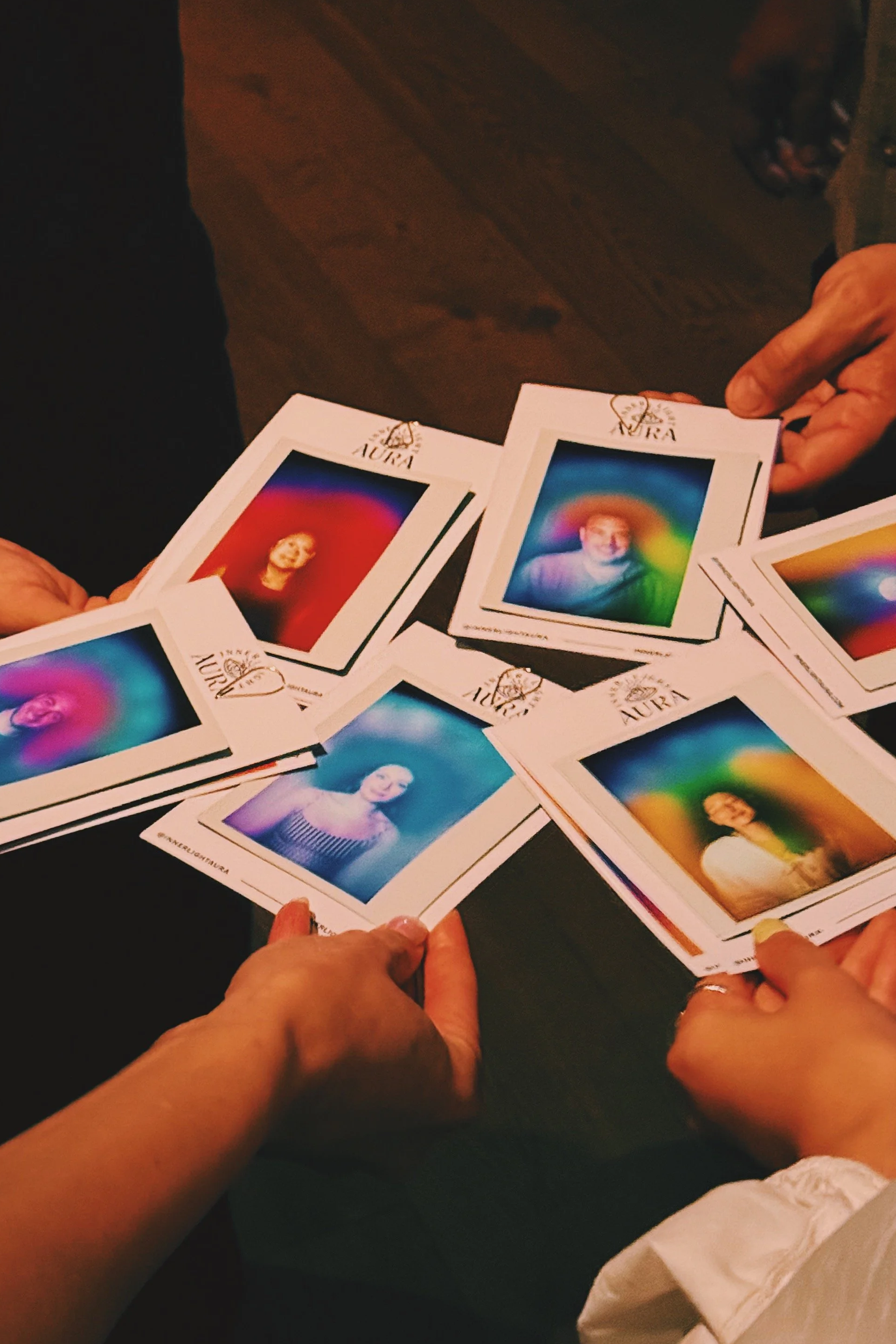 Guests comparing aura portraits at NYC brand event by Inner Light Aura
