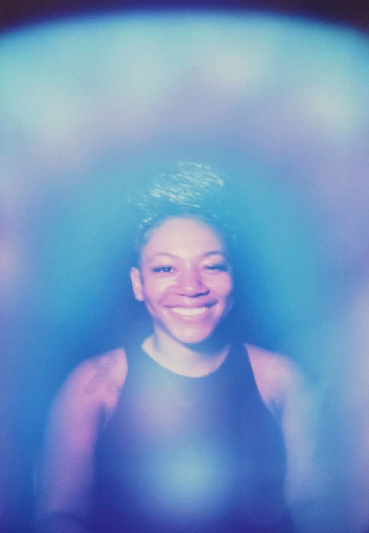 Blue aura photograph with a calm blue field surrounding a persons body.