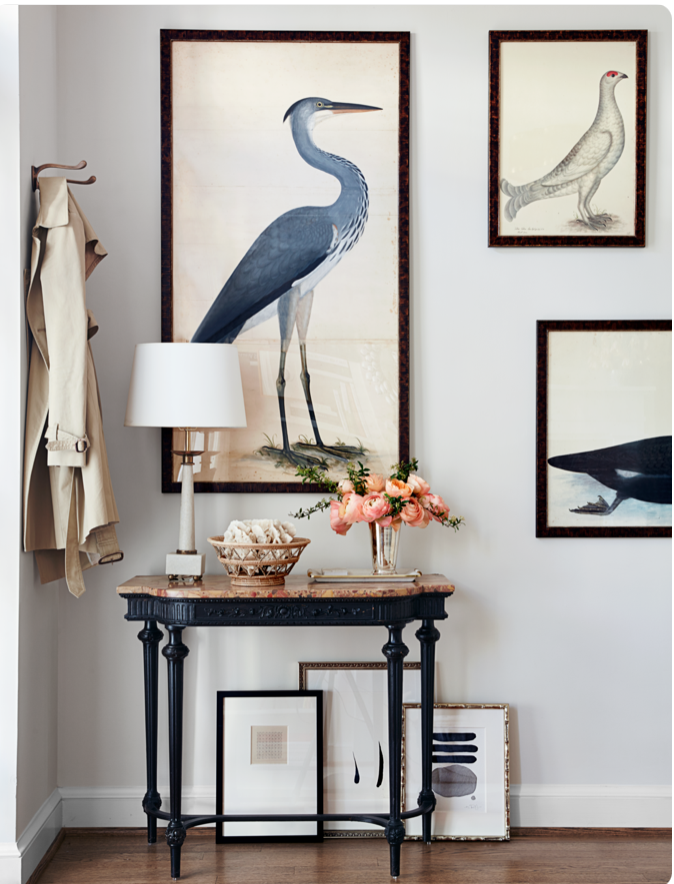 Vintage artwork and a table for keys and mail make any entry useful and beautiful.