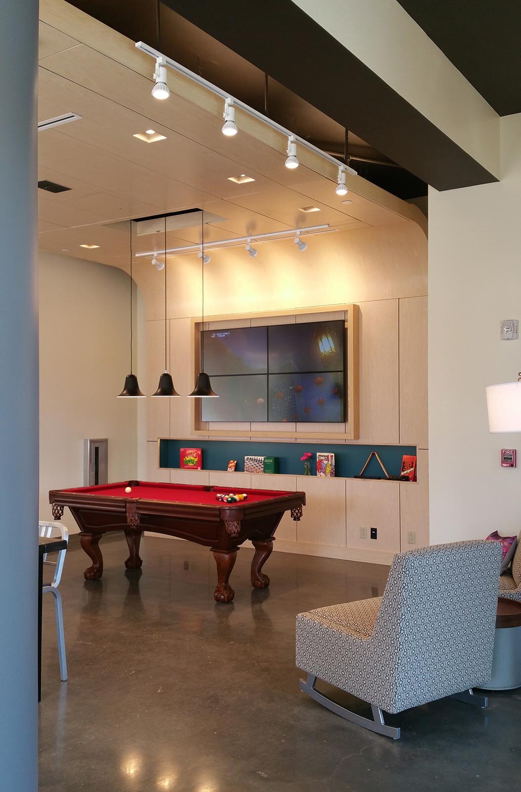 Lounge area with a red pool table