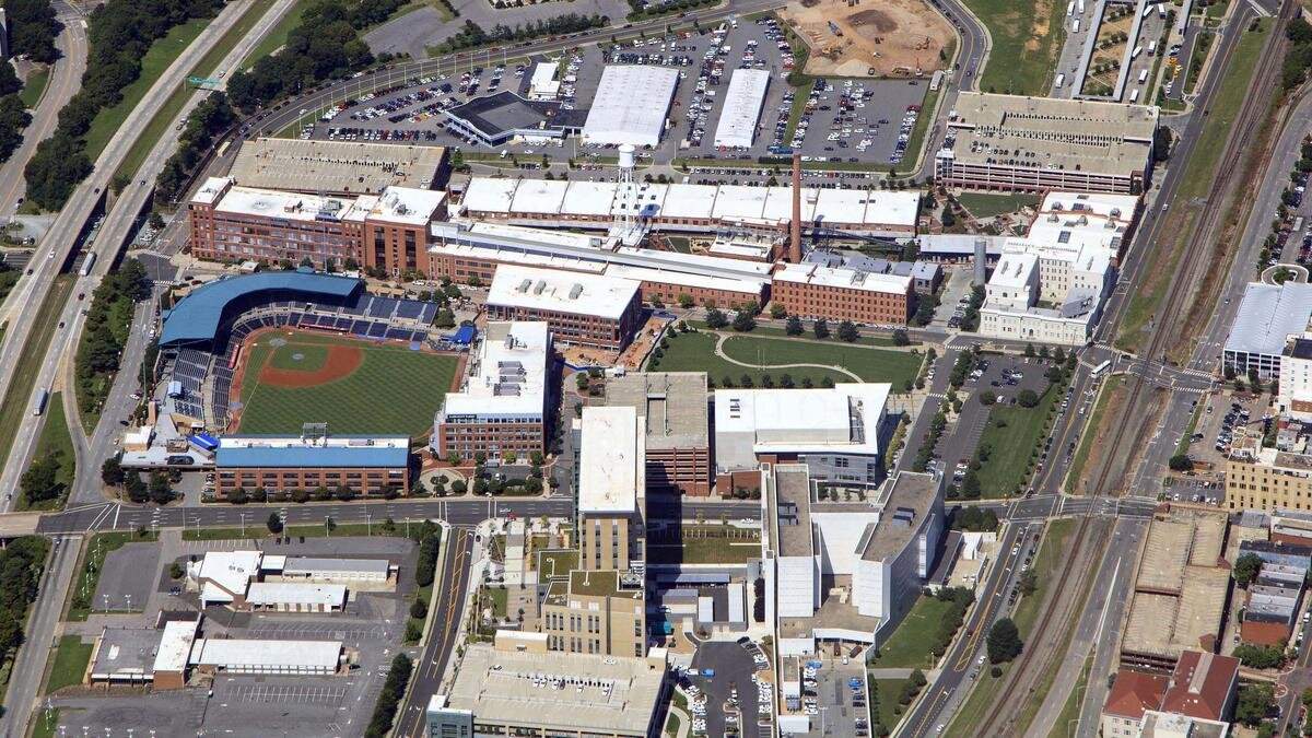 Aerial view showing buildings surrounding a baseball field