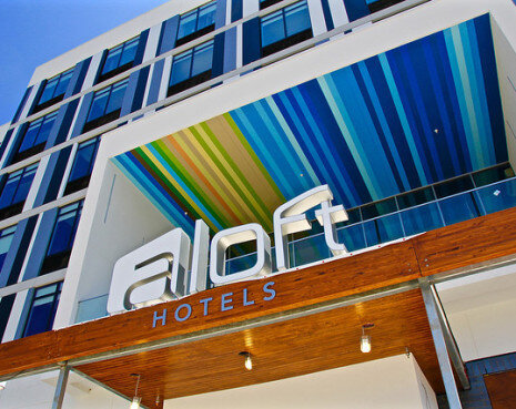 Aloft Hotel signage with bright striped accent wall