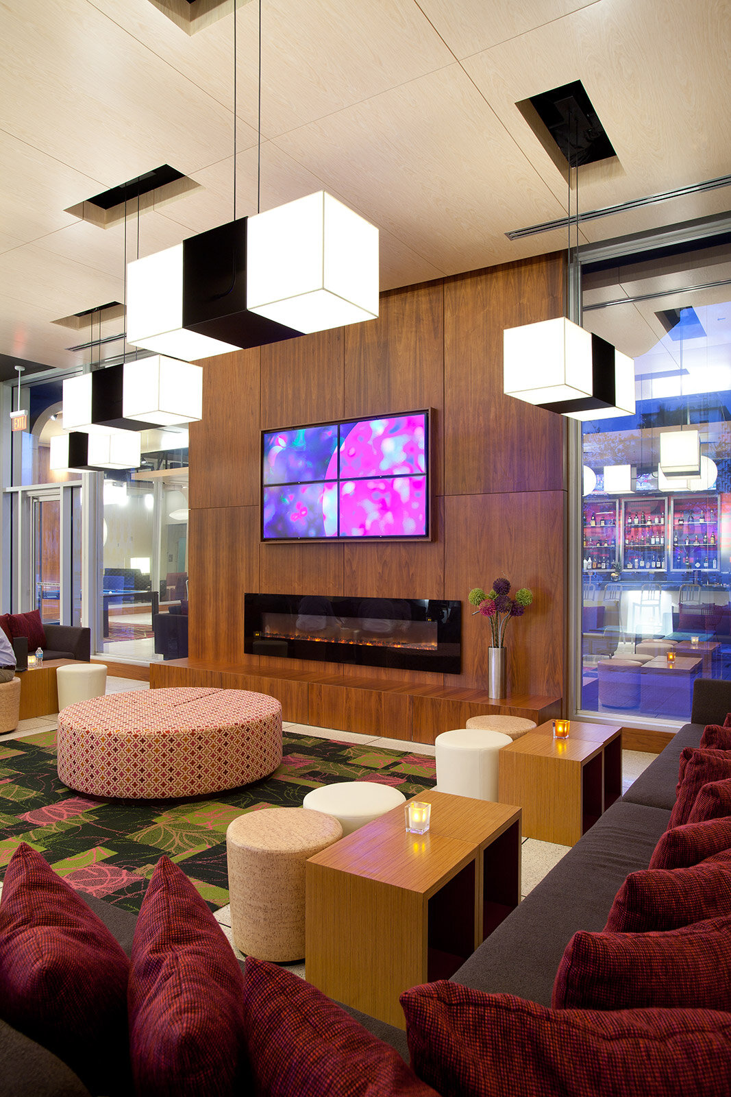 Lobby seating area with a television and fireplace