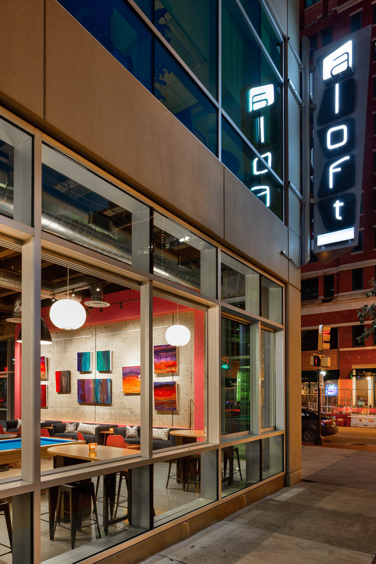 Exterior view at night into the WXYZ Bar &amp; Lounge