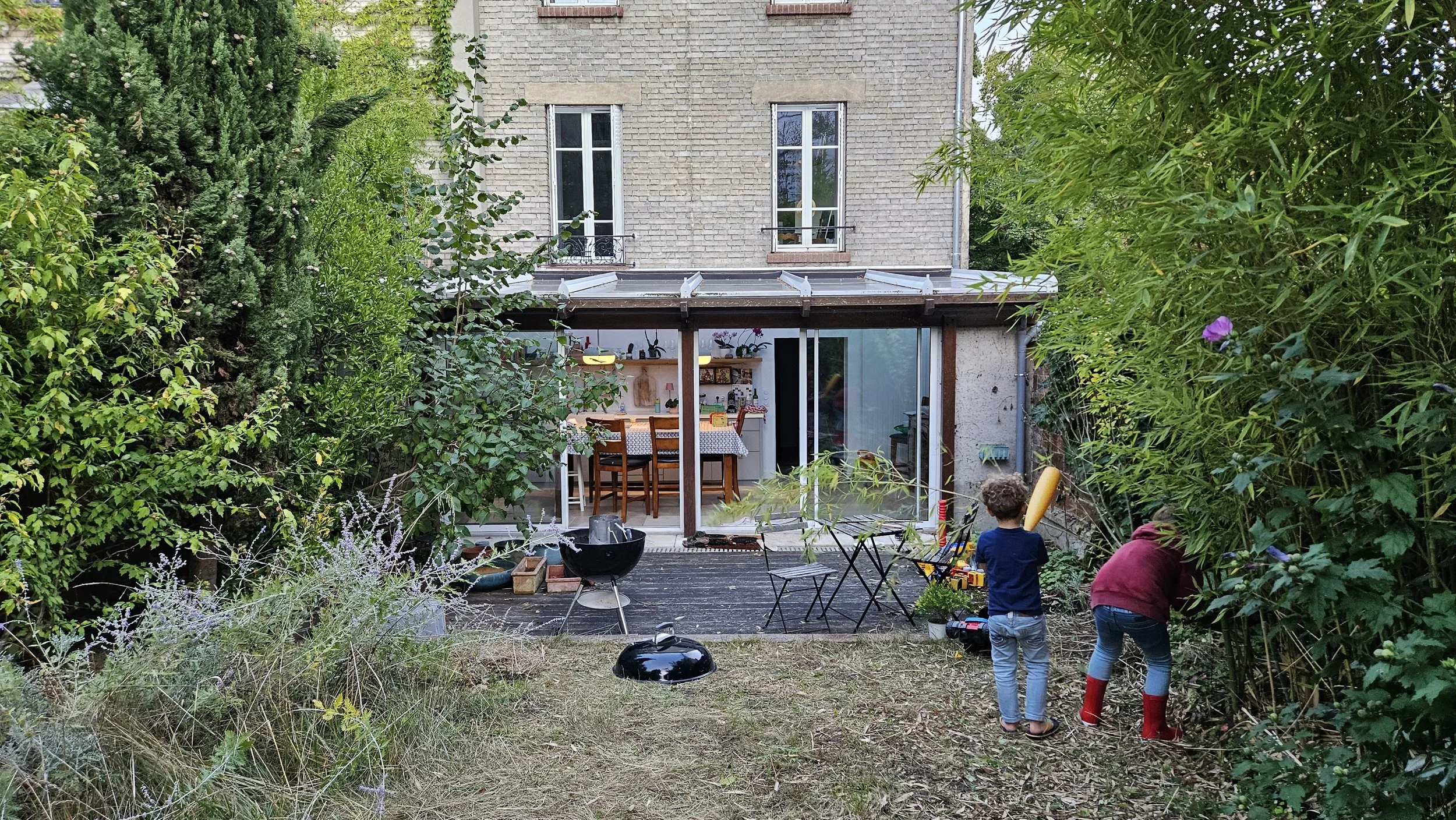 backyard  |  view of home with kitchen set in veranda