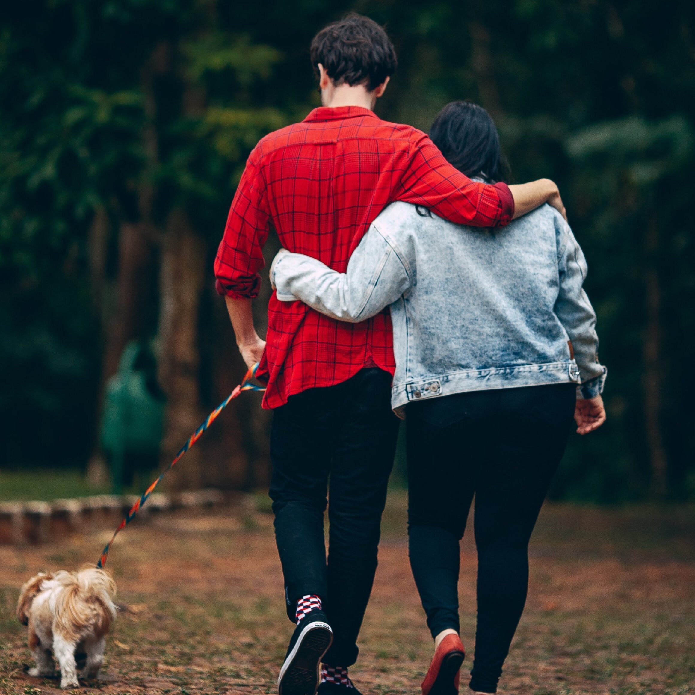 man-and-woman-holding-each-other-with-dog-2055230.jpg