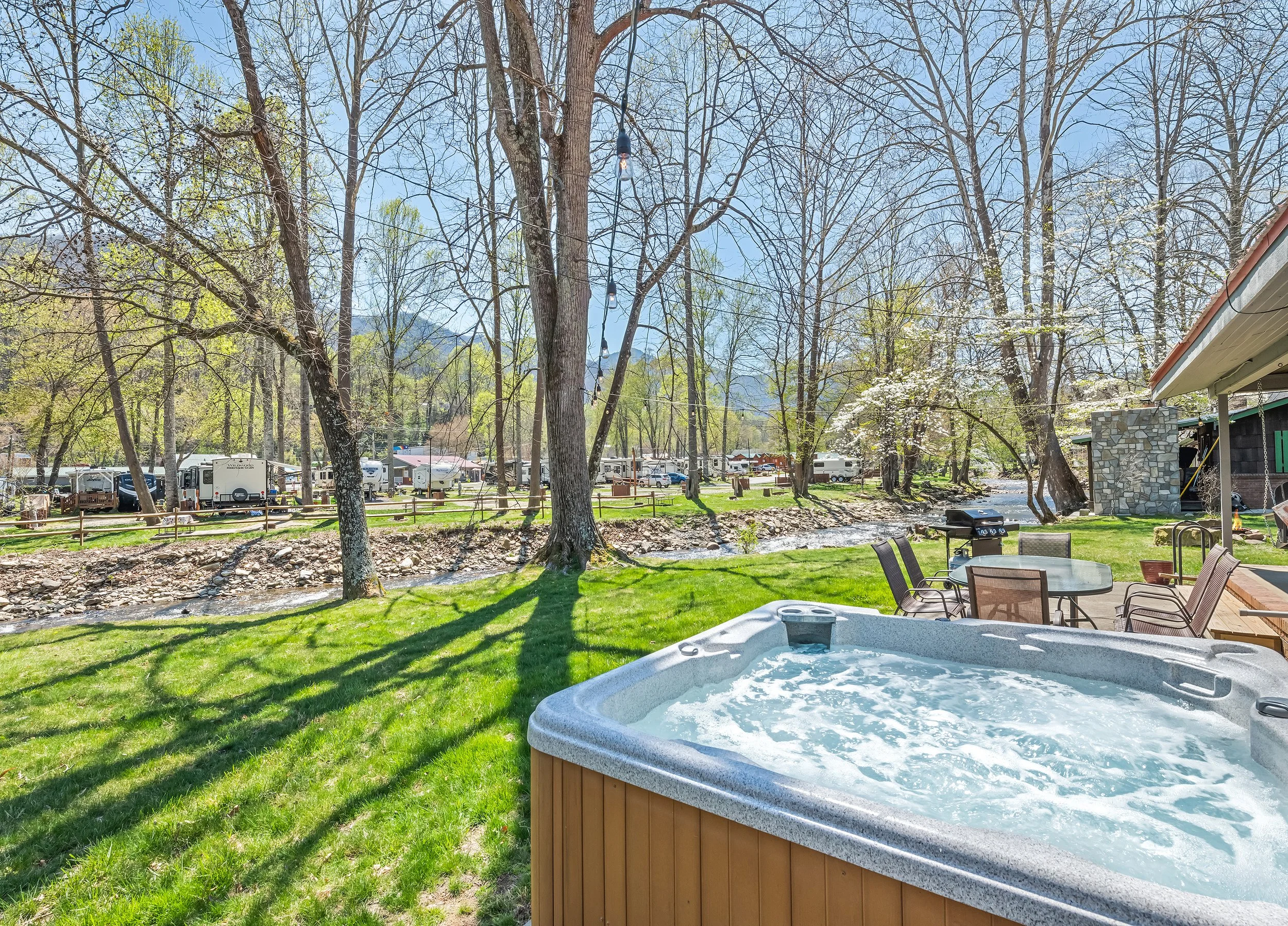Hot Tub with Creek & Winter Mountain View.