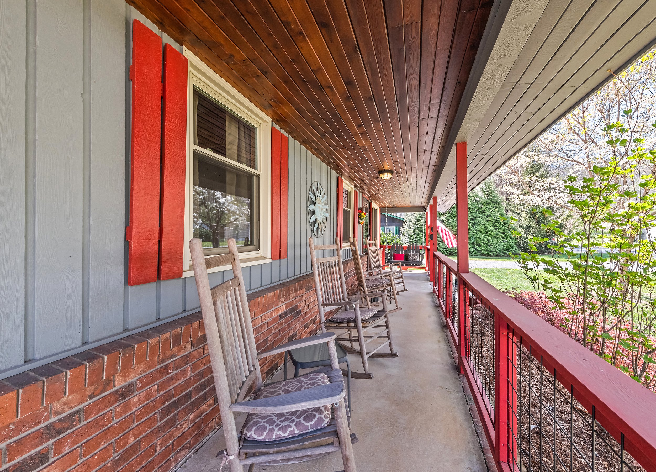 Enjoy relaxing on the front porch of your vacation home in Maggie Valley.