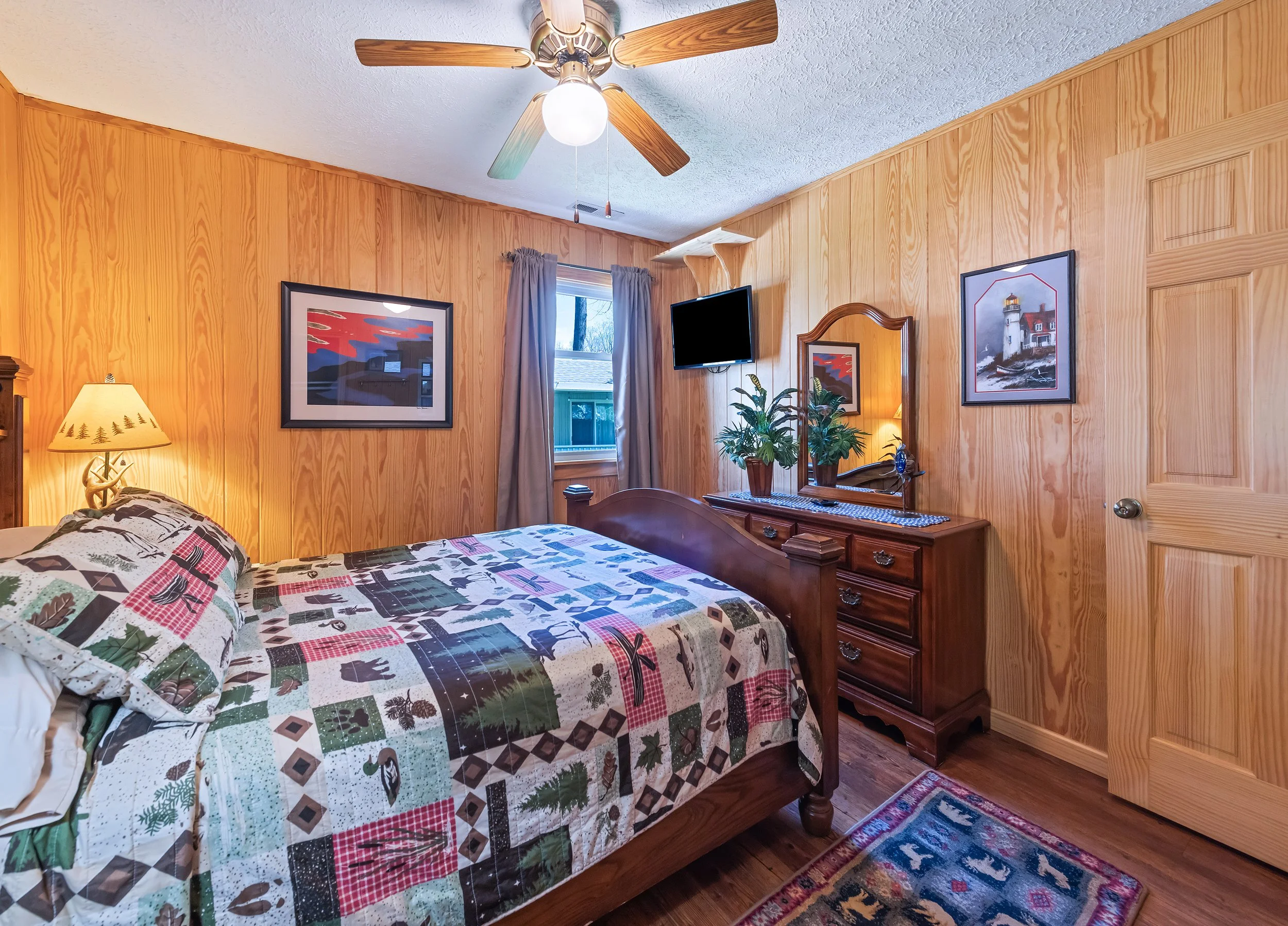 2nd bedroom with TV, dresser & 2 nightstands.