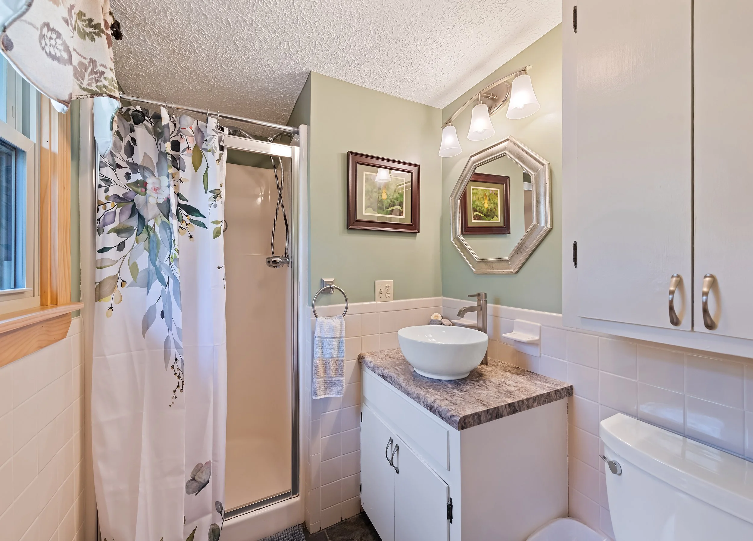 Primary bedroom full bath with walk-in shower.
