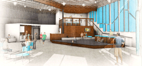 A spacious modern lobby with a high ceiling, large windows, a wooden stage, and seating areas with people sitting and walking around.