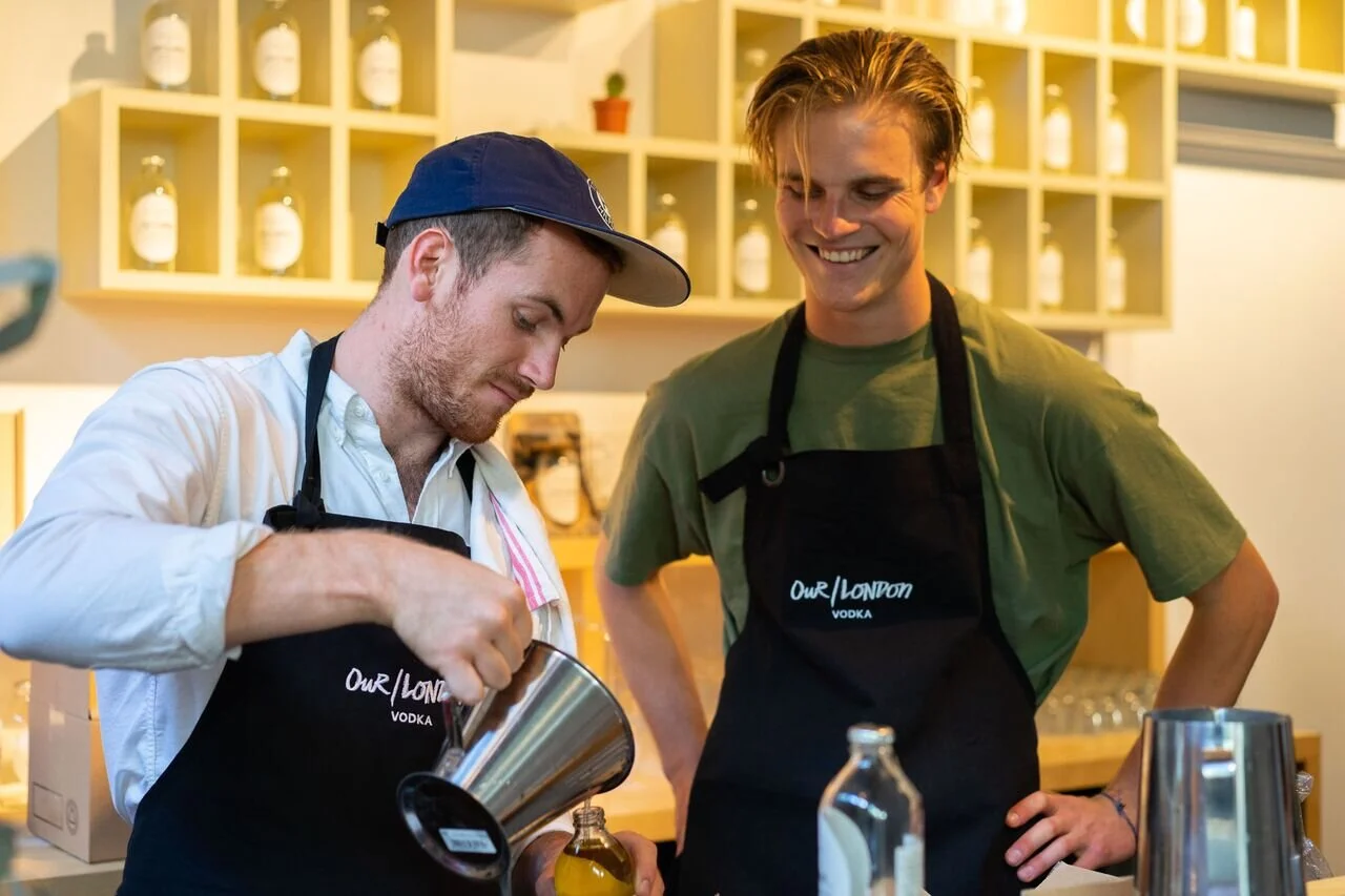 Aaron shows Jack how to pour.jpeg