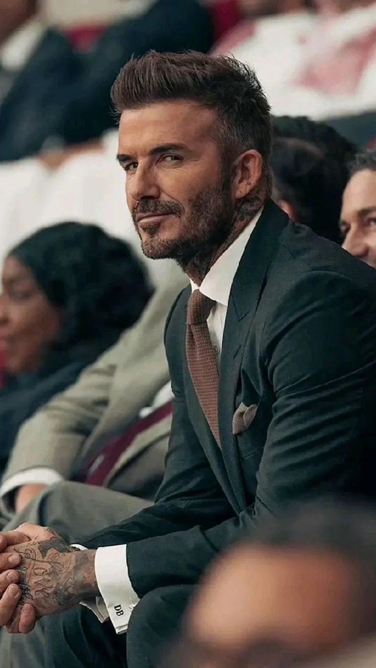 David Beckham posing at sports match