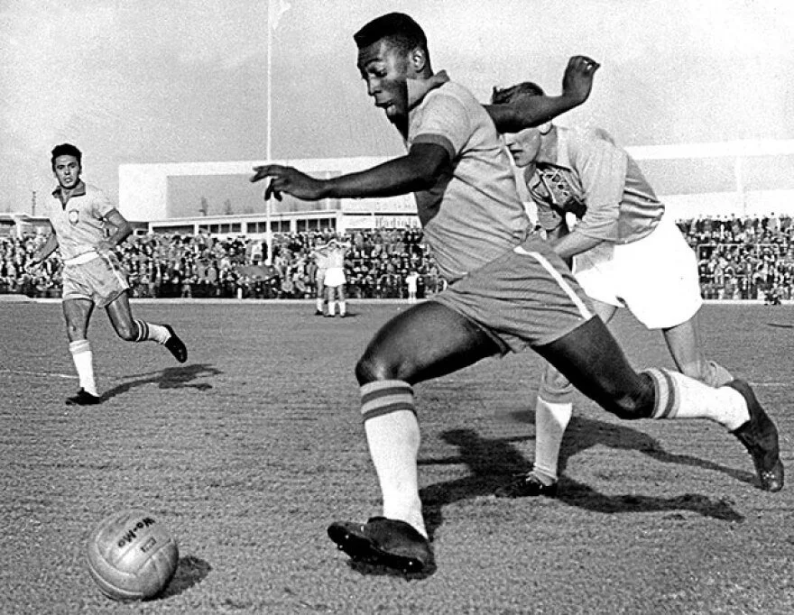 Pelé Seleção scoring or dribbling in classic Brazil yellow number 10