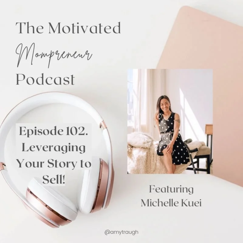 Promotion for The Motivated Mompreneu Podcast featuring episode 102 titled "Leveraging Your Story to Sell!" with a photo of Michelle Kuei, a woman sitting on a bed in a well-lit room, alongside a white and pink pair of headphones and a background of soft pastel colors.
