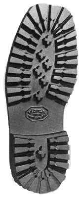 17. 1967 Black-and-white image of a Vibram lugged rubber boot outsole showing deep traction pattern.jpg
