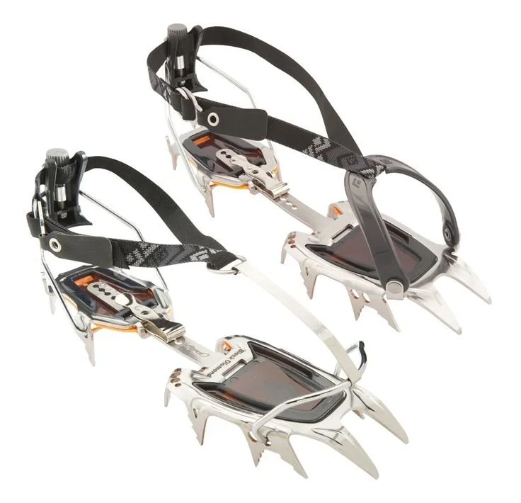 25. Pair of modern Petzl mountaineering crampons shown on a white background with adjustable bindings and front points.jpg