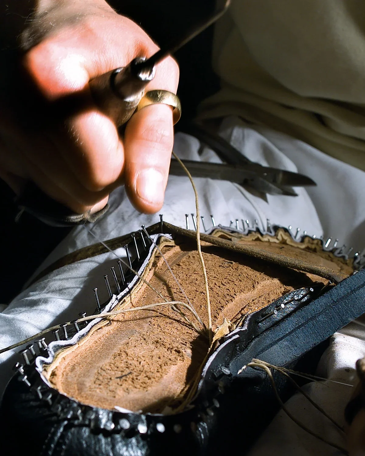 Hand-sewing-in-Bespoke-room.webp