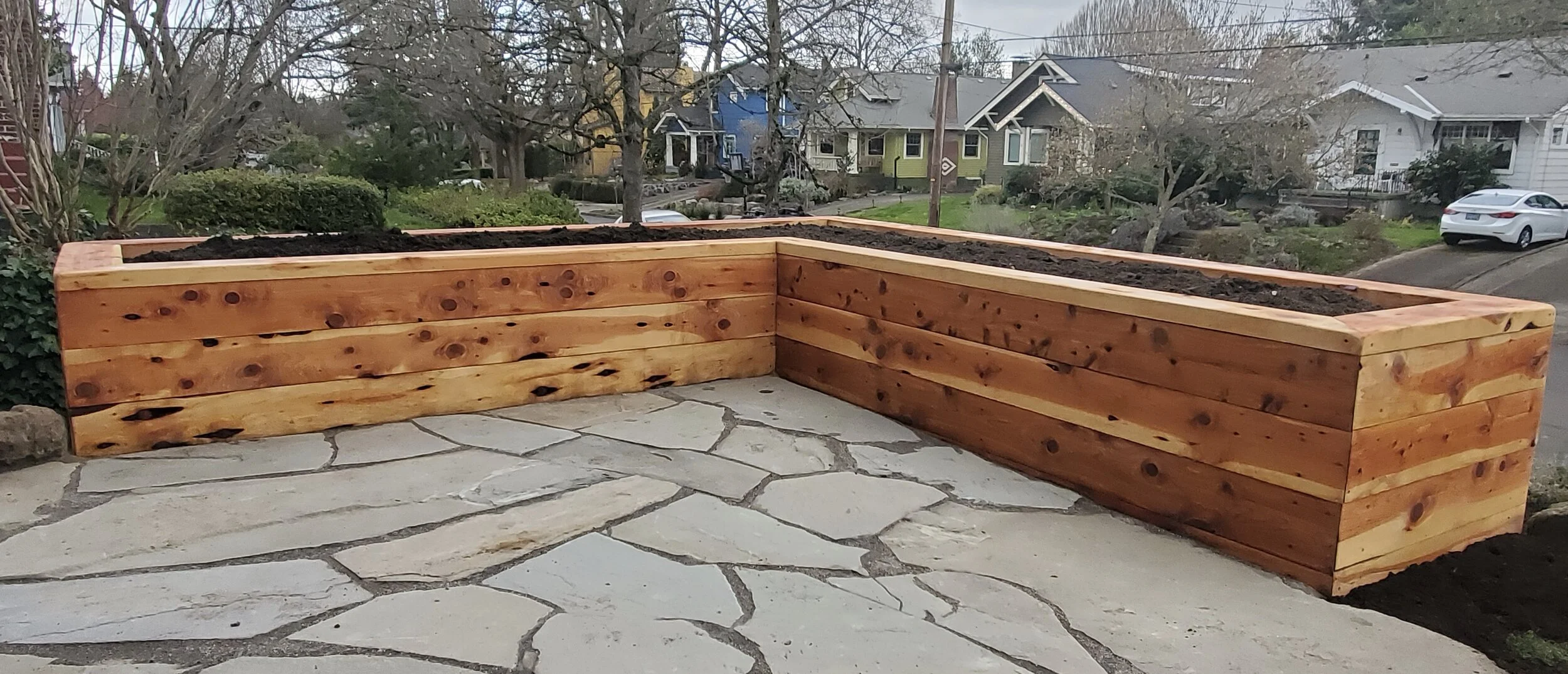 Juniper_raised_garden_bed_with_falgstone_patio.jpeg