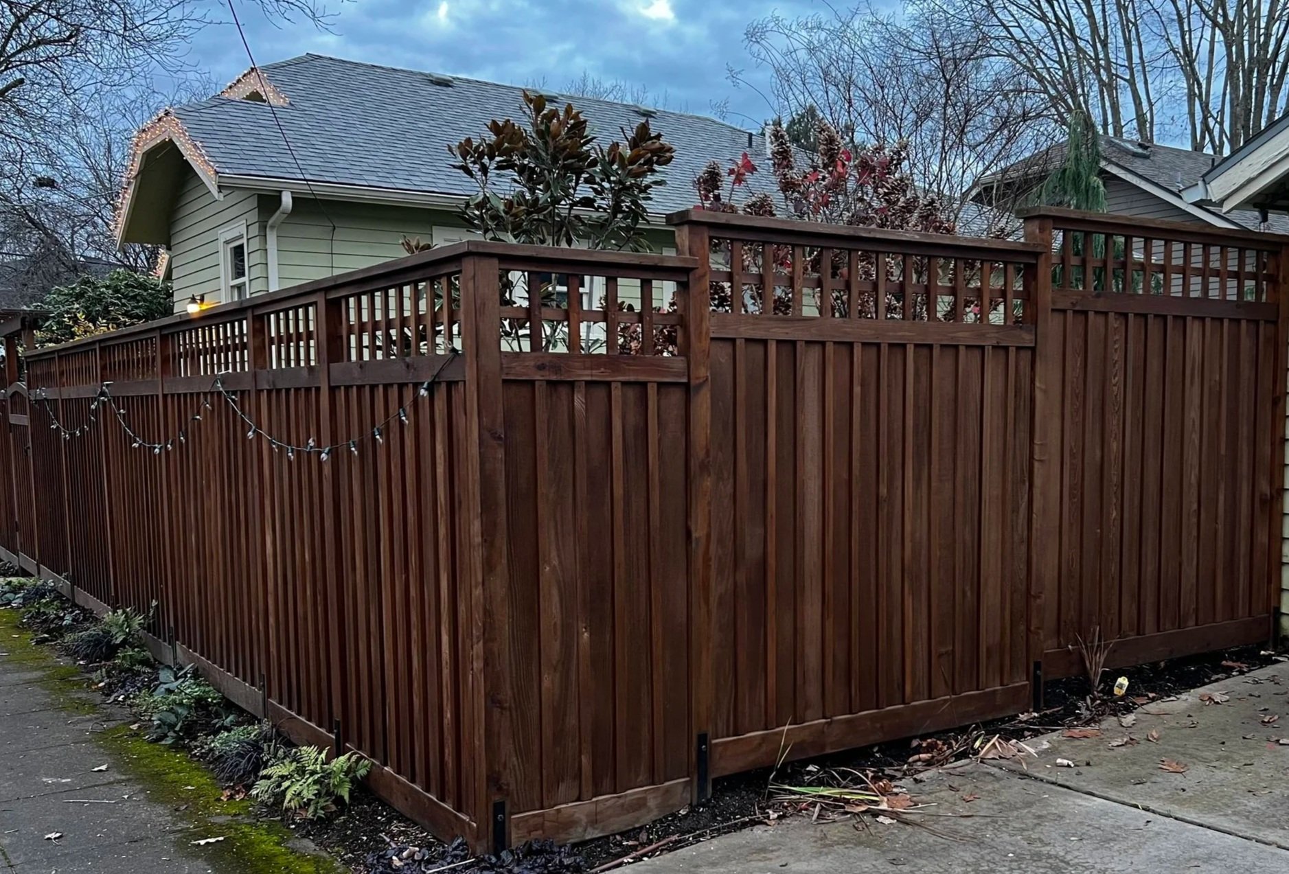 vertical boar don batten fence with lattice