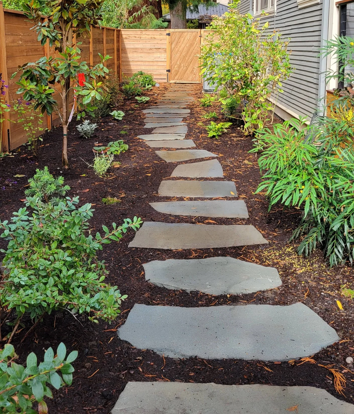 stepping stone pathway floating in mulch flagstone