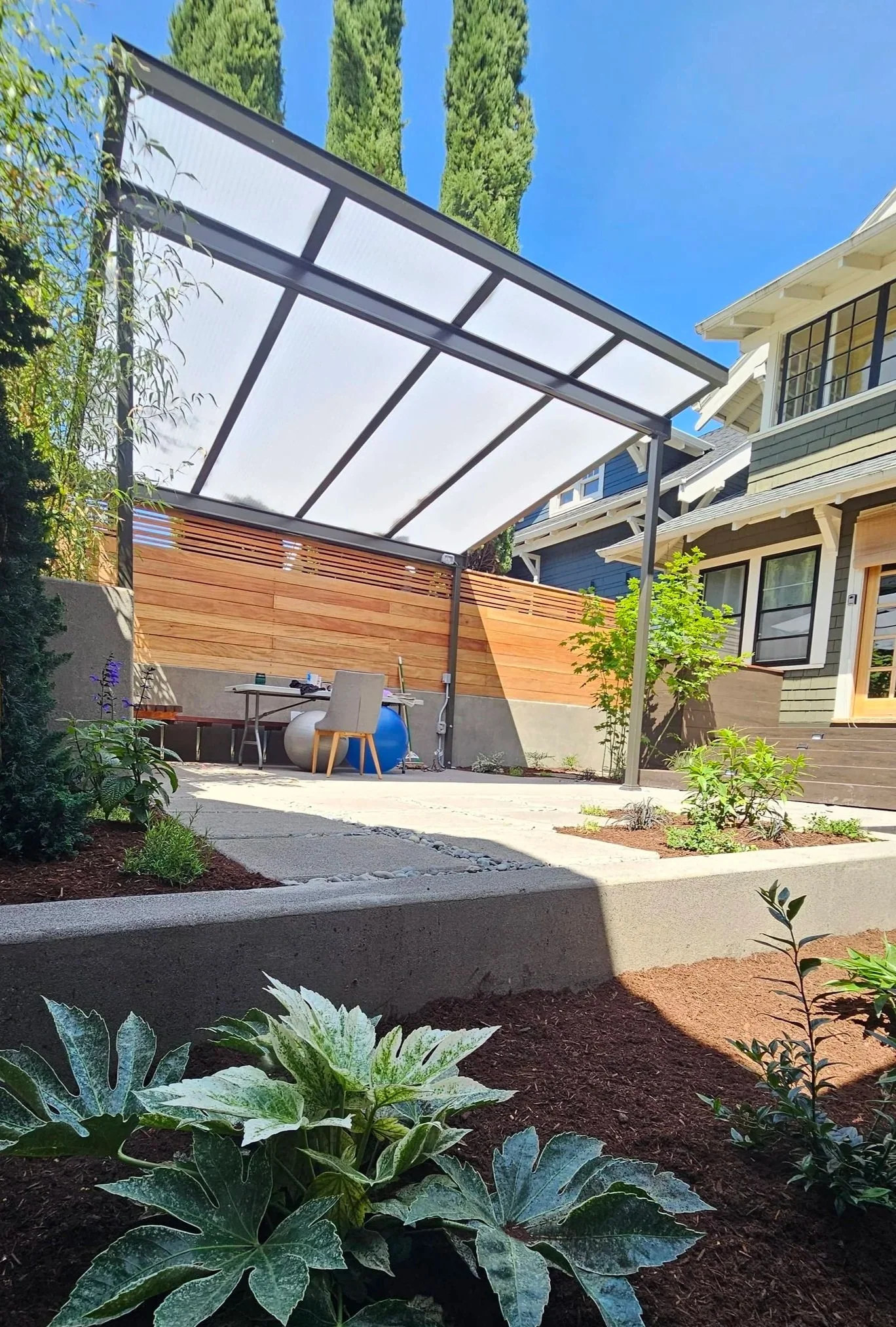 metal pergola small modern back yard concrete patio 