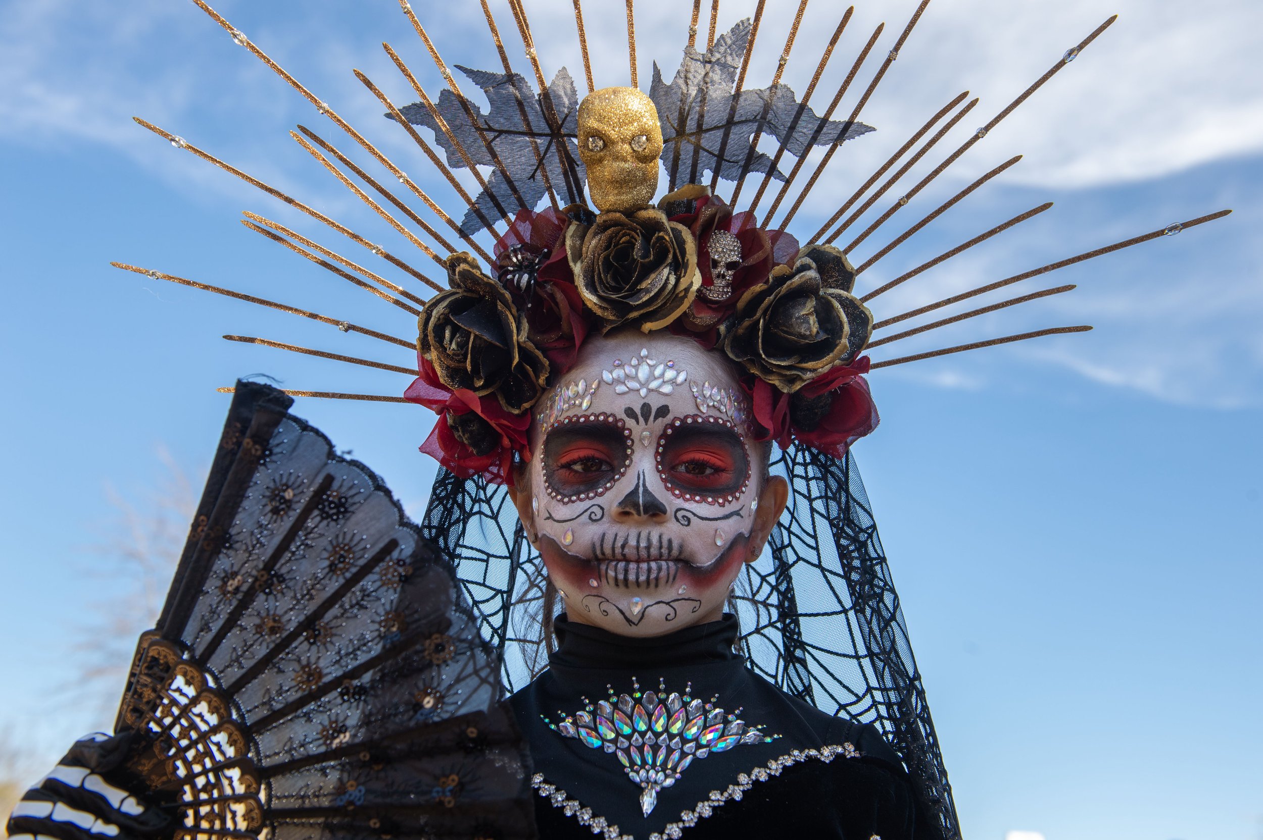  First place winner in the mini Catrina competition Italia Pardo, poses for photos during the Dia de Los Muertos celebration on Saturday, Nov 5, 2022, in Kansas City, Kan. 