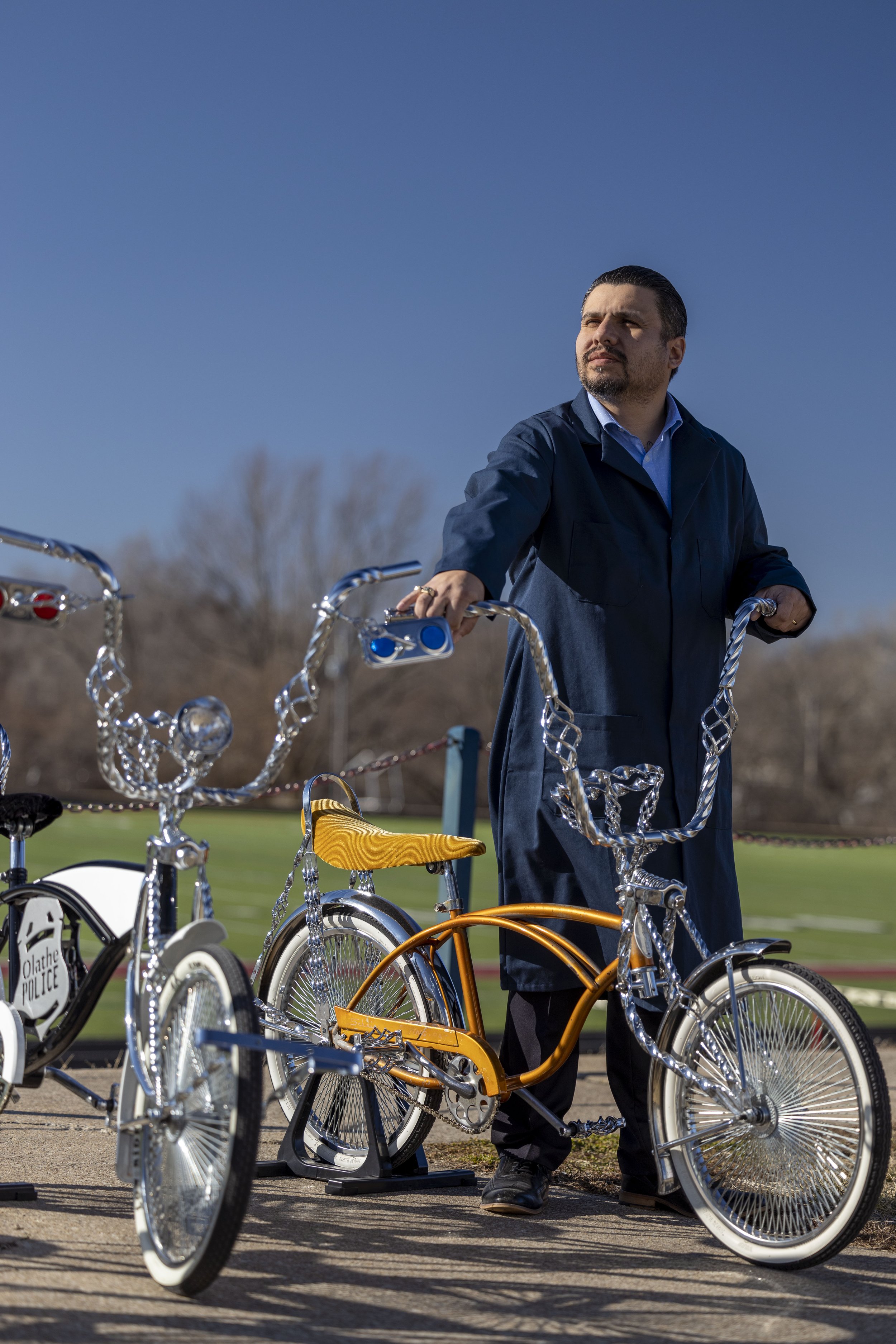  Erik Erazo, executive director of diversity and engagement, for the Olathe school district, is seen holding a lowrider bike on Thursday, Feb. 17, 2022, in Olathe, Kansas. Erazo has created programs that have changed the lives of dozens of Hispanic a