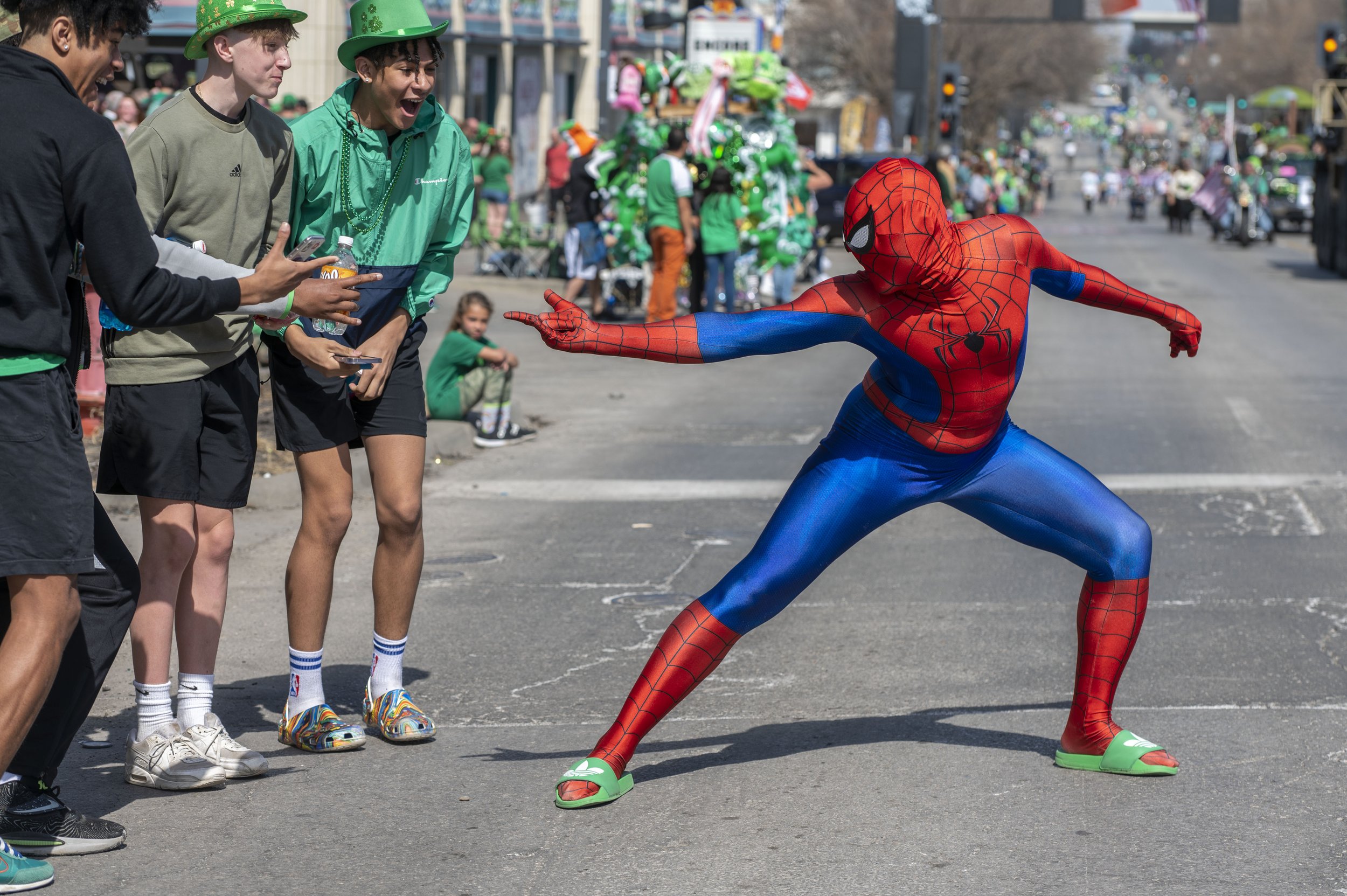  A man dressed in a Spider-Man costume thrilled the crowd during the St. Patrick’s Day parade on Thursday, March 17, 2022, in Kansas City.  