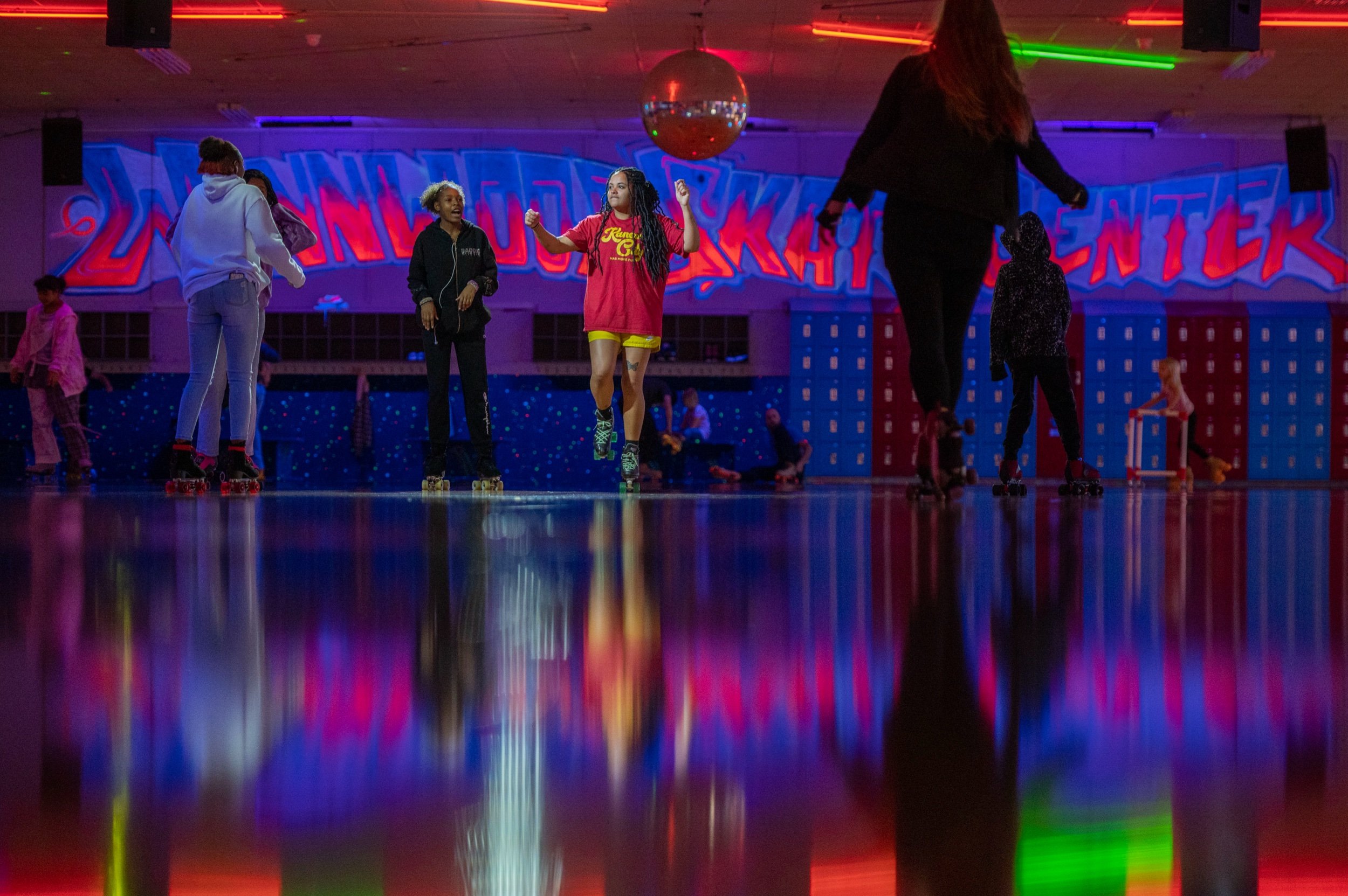  Skaters dance in the middle of the arena at Winnwood Skate Center on Wednesday, Jan. 11, 2023, in Kansas City. The skate center, responding to a New Year's Eve panic triggered by a pinball machine incident mistaken for gunshots, has implemented a po