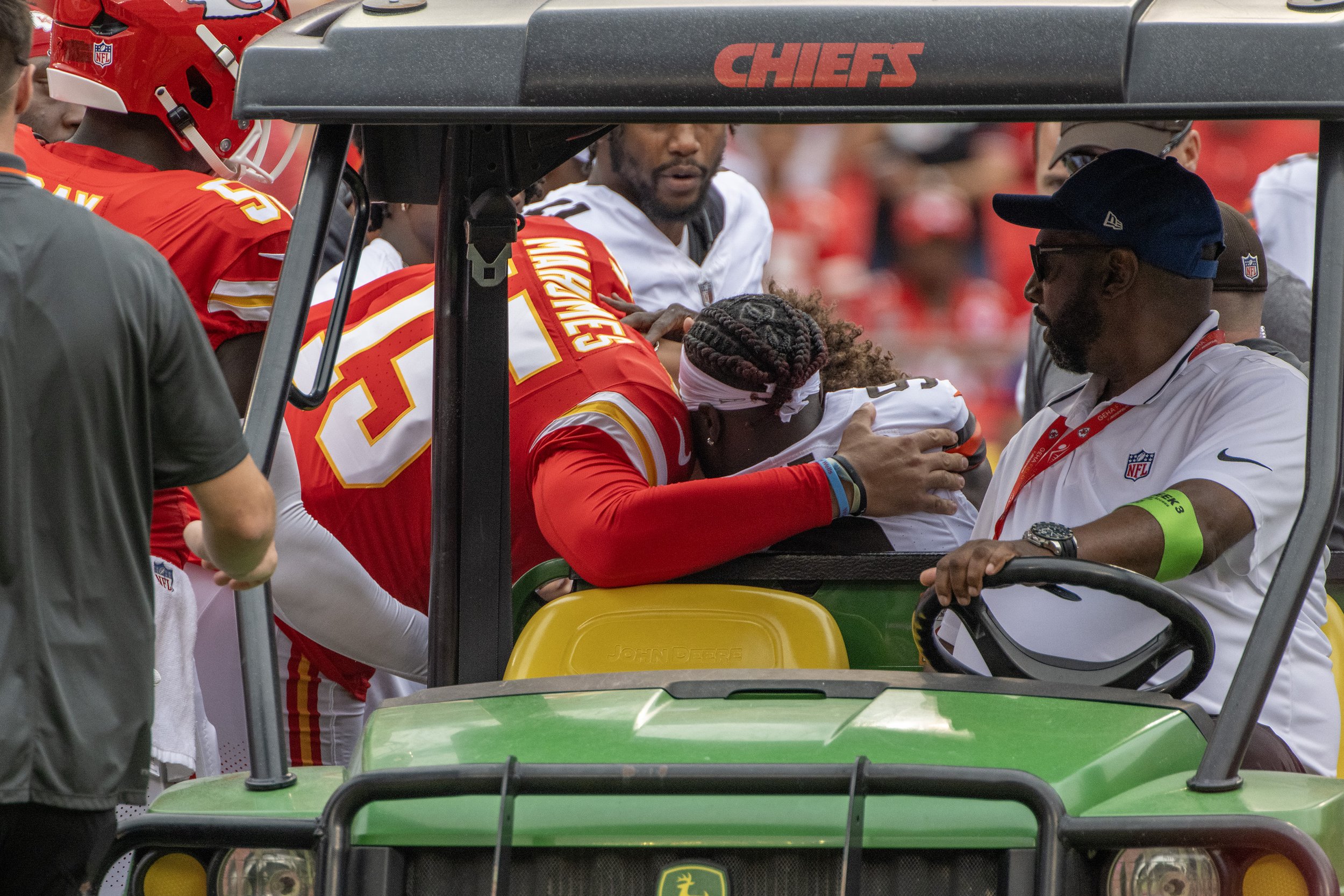  Kansas City Chiefs quarterback Patrick Mahomes (15) hugs Cleveland Browns wide receiver Jackeem Grant Sr. (9) after being hit during an NFL preseason game at GEHA Field at Arrowhead Stadium on Saturday, Aug. 26, 2023, in Kansas City. 