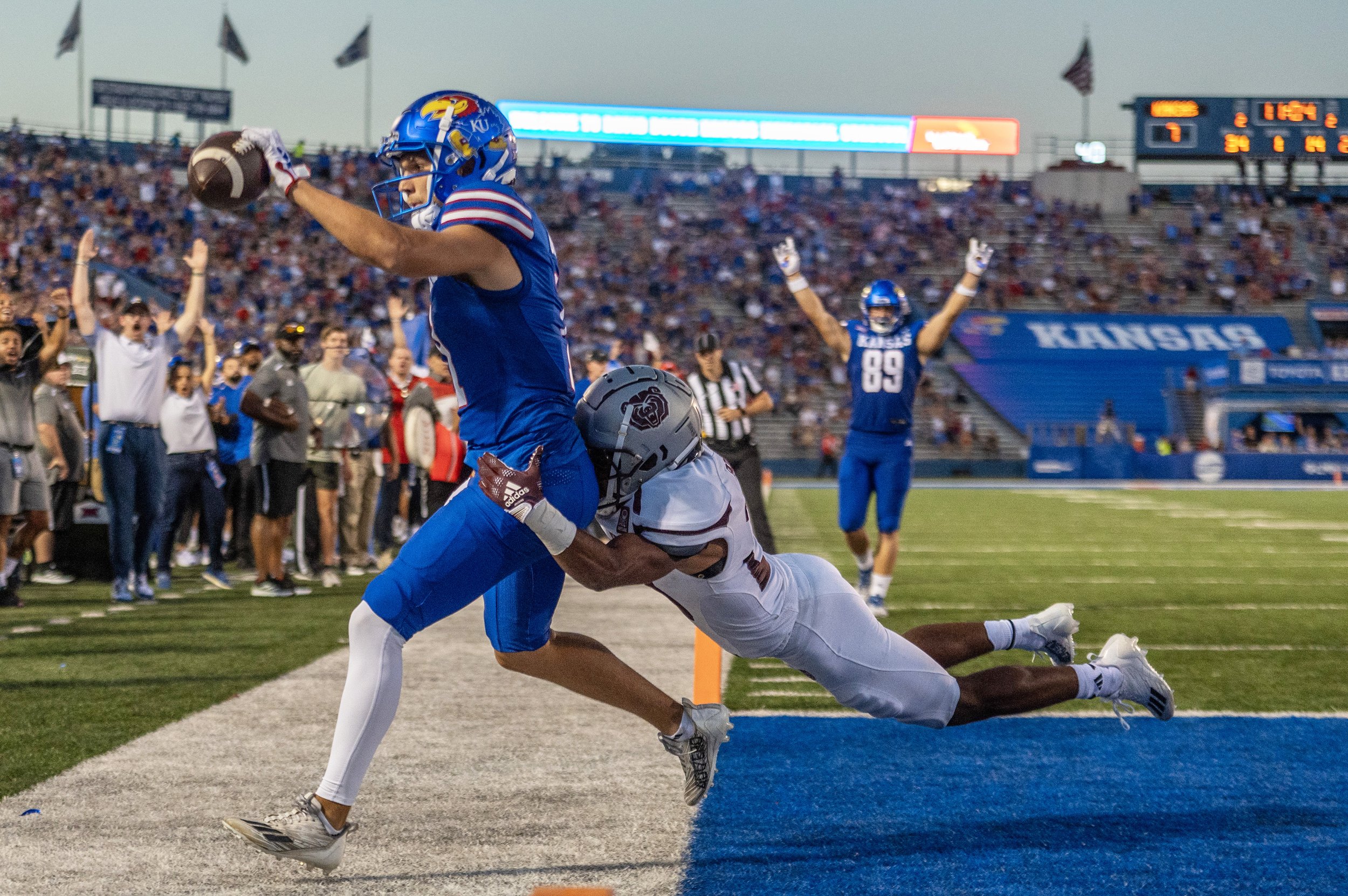  Kansas Jayhawks wide receiver Luke Grimm (11) scores a touchdown in the second quarter during the season opening game at David Booth Kansas Memorial Stadium on Friday, Sept. 1, 2023, in Lawrence, Kan. 