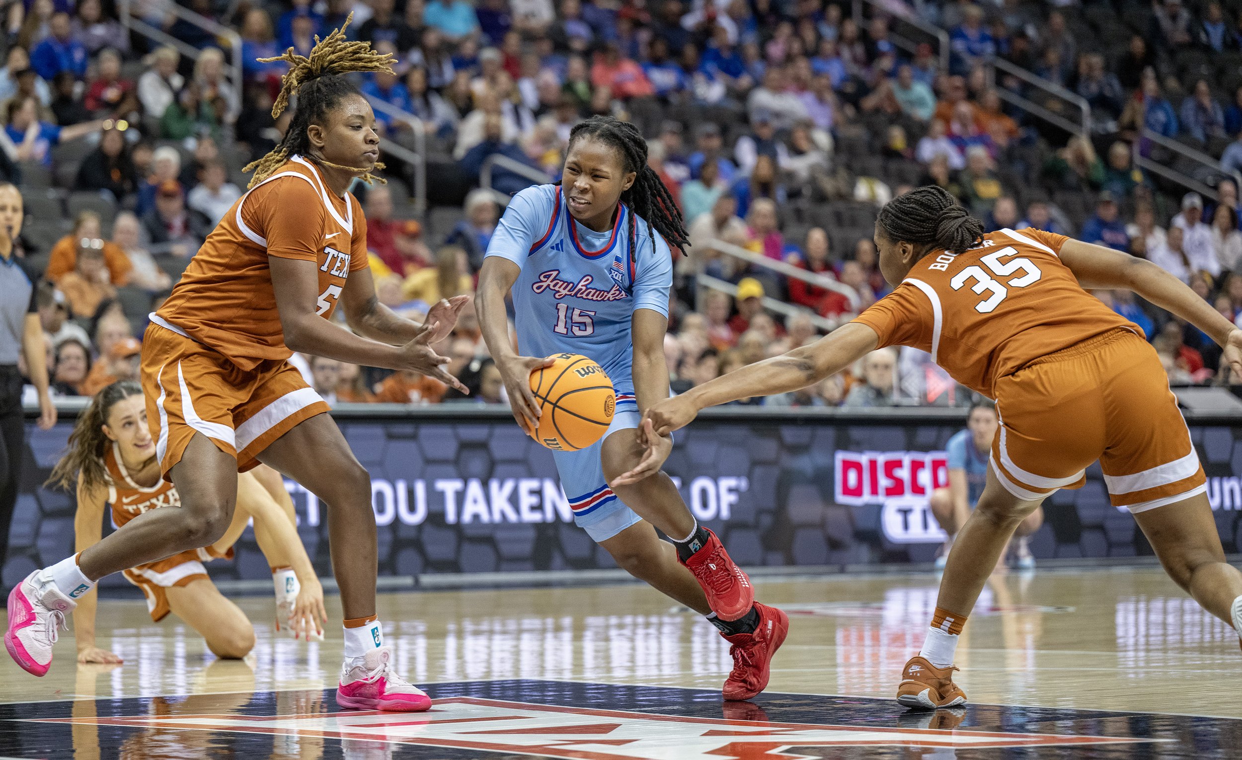  Kansas Jayhawks guard Zakiyah Franklin (15) is fouled by Texas Longhorns forward Madison Booker (35) in the first half of a Big 12 Tournament women’s basketball game at T-Mobile Center on Saturday, March 9, 2024, in Kansas City.    