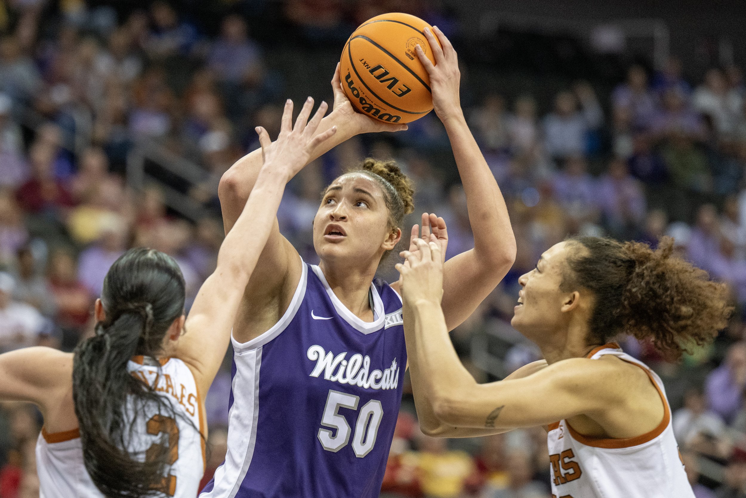  Kansas State Wildcats center Ayoka Lee (50) attempts a shot in the first half of the Big 12 Tournament women’s basketball semifinal game against the Texas Longhorns at T-Mobile Center on Monday, March 11, 2024, in Kansas City. 