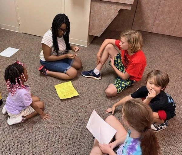 SLAM GPC 2023 Kids on Ground in Classroom.JPG