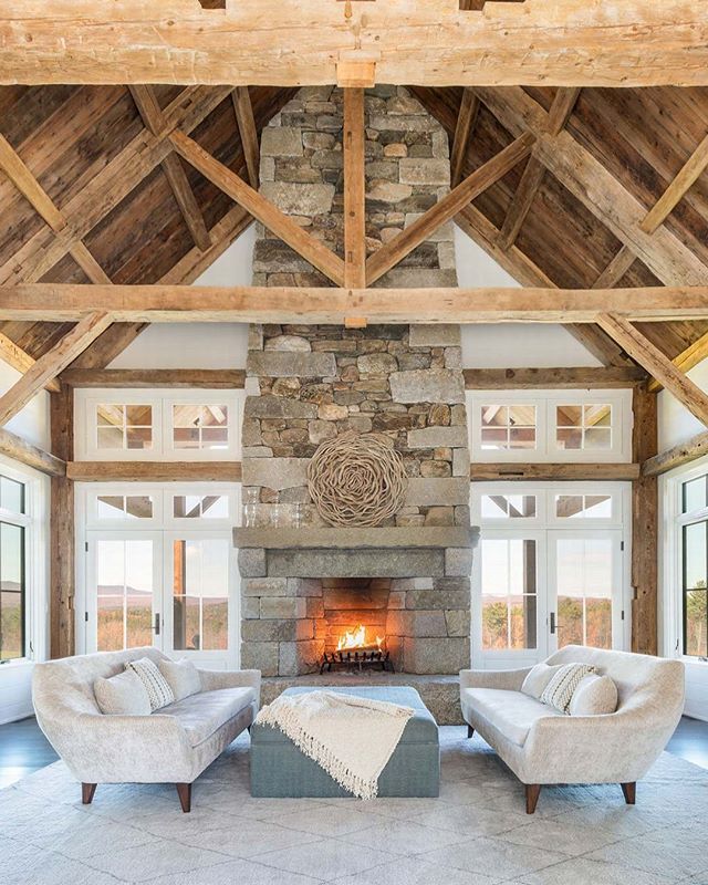 Here is a picture of the great room we built.  The raised hearth is one piece of reclaimed granite.  Most of the antique hewn beams came from old barns my crew and I dissasembled.  This room was like building a ship in a bottle.  The house was conven