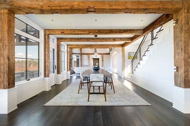 Open concept dining that leads into the great room.  More of our reclaimed beams and a cool custom steel railing by Sam Mosheim @sammovt 
Designed by @ramsaygourd photos by @ridgelightstudio @ianjensen_vt @amshann @blitzkrieg838 #marvinwindows #oldba