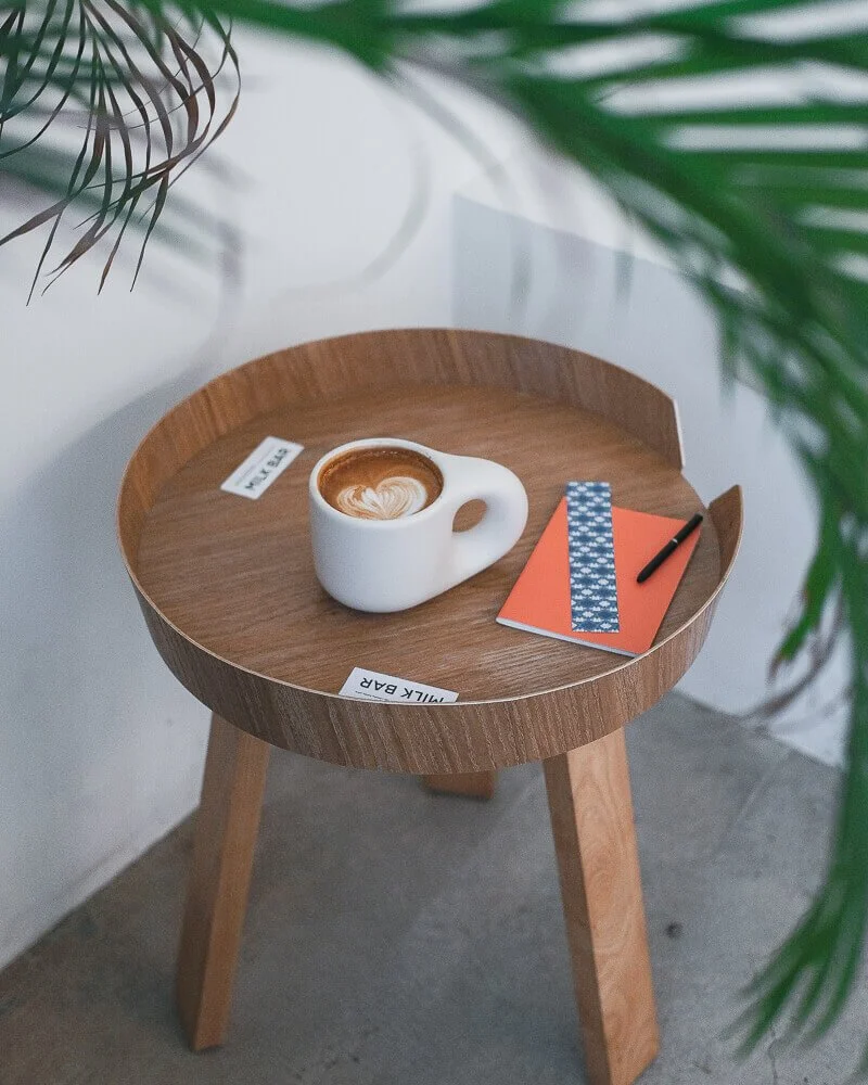 A cappuccino on a cafe table at Milk Bar in Hong Kong
