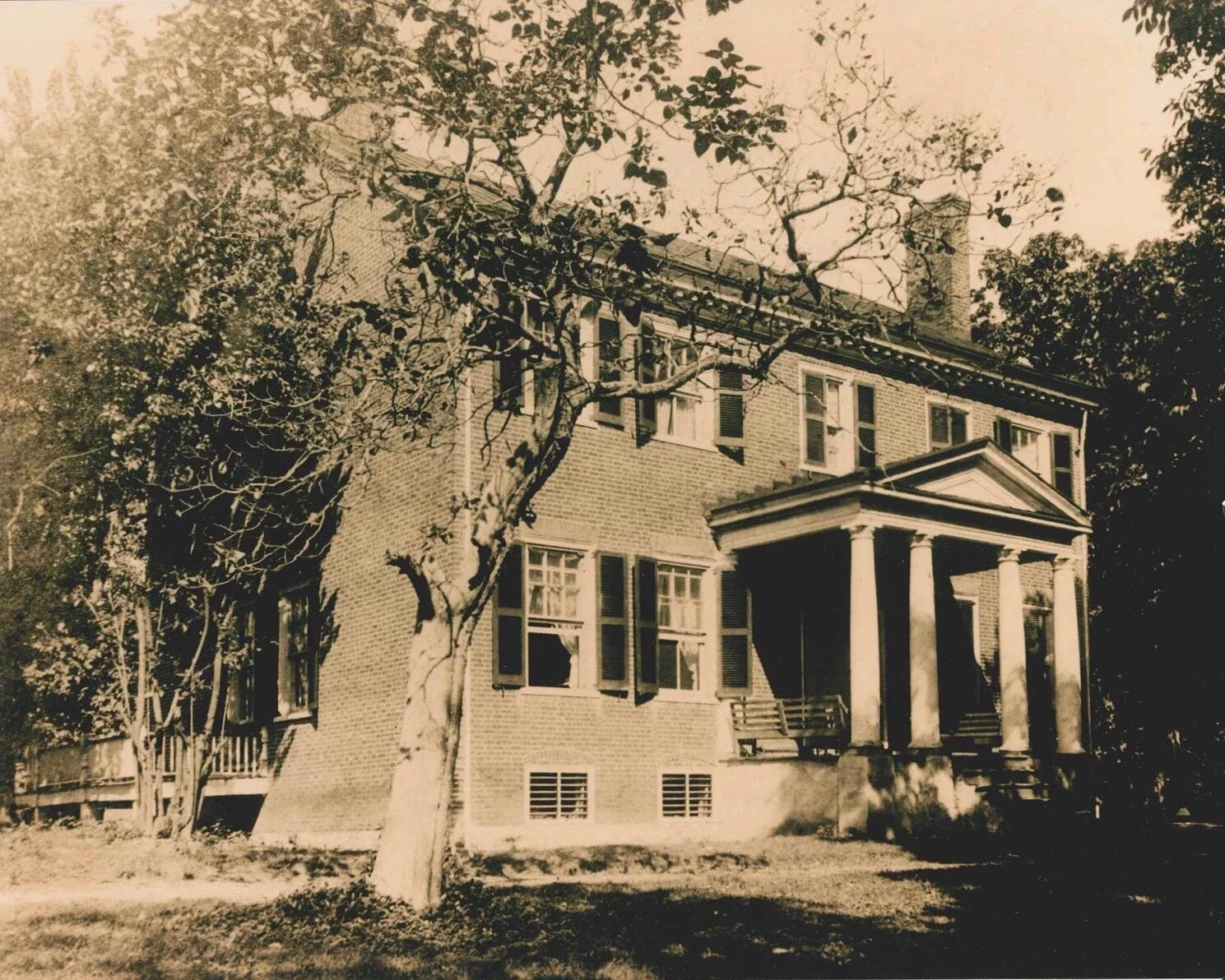 Morven Main House, a brick mansion with four white column front porch, photographed in black and white.