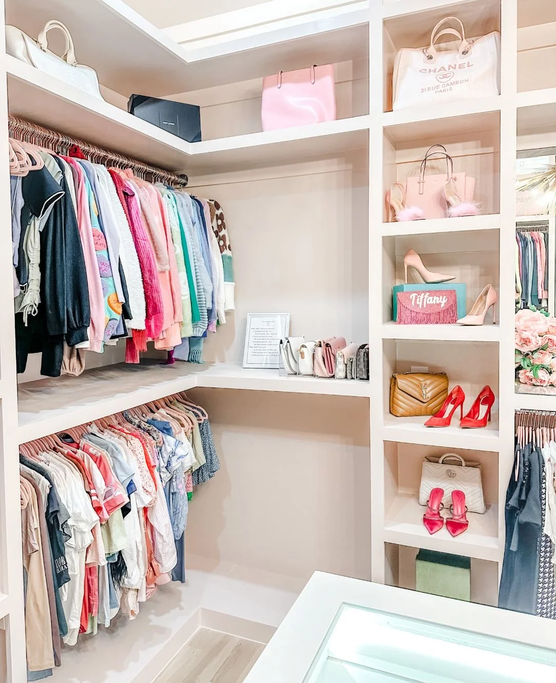 Boutique-style closet organized by the Organized Calm professional organizing team in Dallas